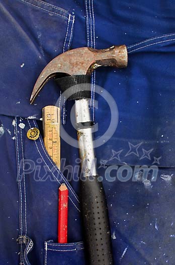 Carpenters tools on a blue stained fabric