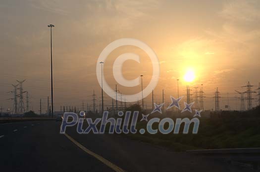 Sunset over the electricity poles