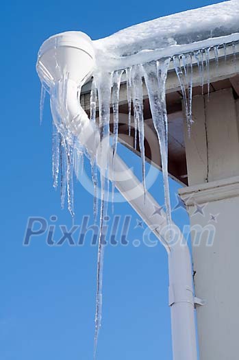 Long icicles hanging from the eaves Long icicles hanging from the eaves