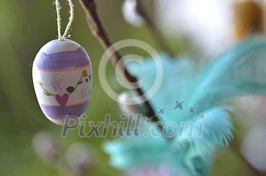 Easter egg hanging on the branch