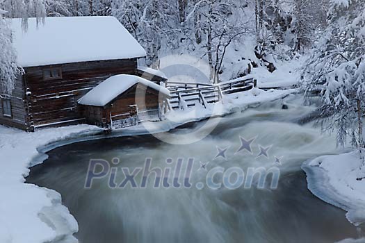 Winter house by the icy river
