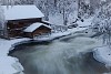 Winter house by the icy river