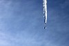 Icicle melting on a blue background