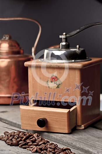 Old coffee grinder with coffee beans Old coffee grinder with coffee beans