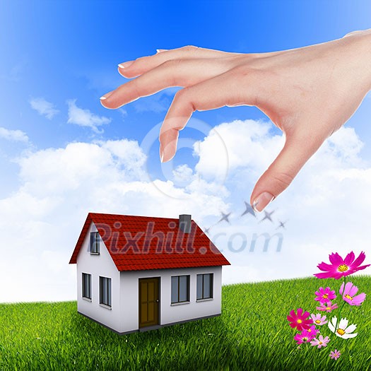 Human hand against blue sky background and house Human hand against blue sky background and house