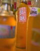 Bottles of Sima standing on table.