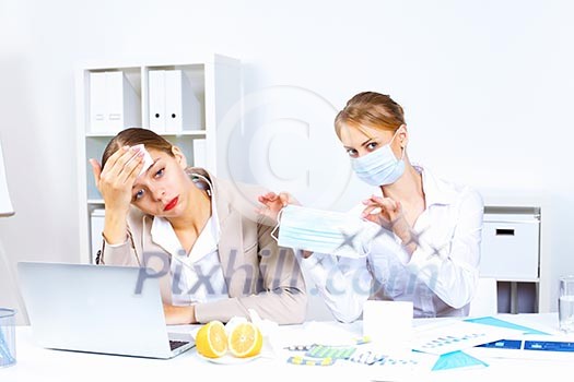 Young woman feeling unwell and sick in office Young woman feeling unwell and sick in office