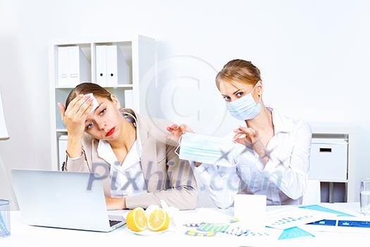 Young woman feeling unwell and sick in office