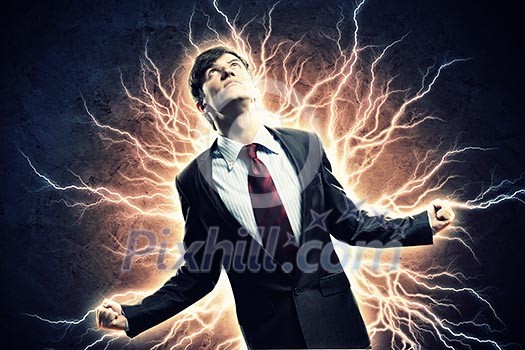 Businessman in anger with fists clenched screaming