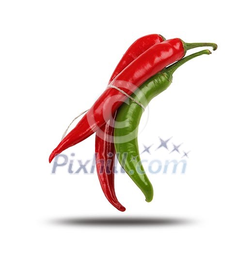 Bright red and bright green chilli pepper rolled into a bun on a white background.