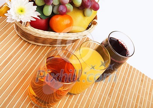 Breakfast of fresh fruit and glasses of various fresh juices