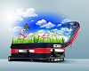 Red suitcase with green nature landscape in it