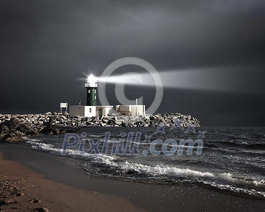 Image of a lighthouse with a strong beam of light