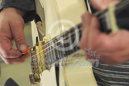 Closeup of a guitar palyer hands