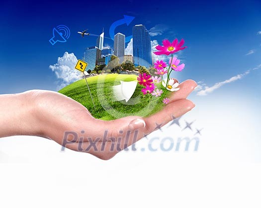 human hand holding a city on green grass hill human hand holding a city on green grass hill