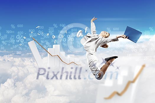Image of a businesswoman jumping high against blue sky background Image of a businesswoman jumping high against blue sky background