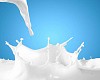 Image of milk splashes against color background