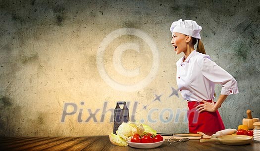 Asian female cook in anger against color background with shine effects