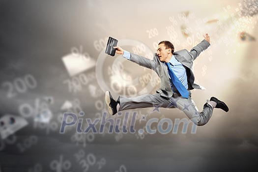 Image of a businessman jumping high against financial background Image of a businessman jumping high against financial background