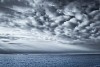 Grey cloudy sky over the sea