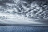 Grey cloudy sky over the sea