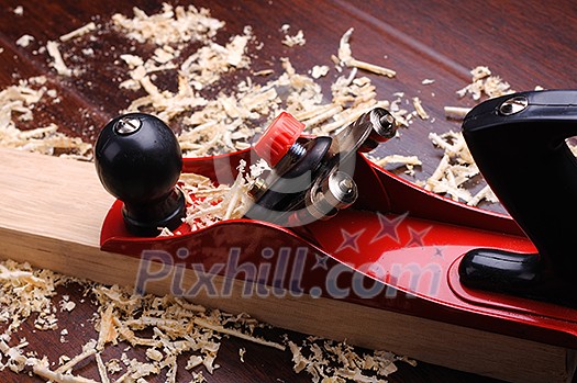 Shavings of wood, brick and red plane Shavings of wood, brick and red plane