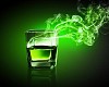 Glass of green absinth with fume going out