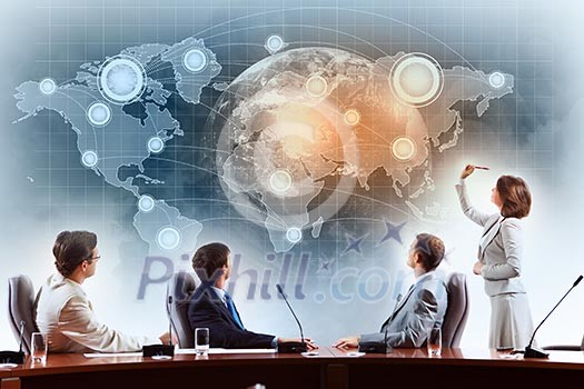 Image of businesspeople at presentation looking at virtual project Image of businesspeople at presentation looking at virtual project