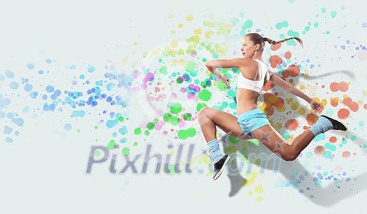 Image of sport girl in jump against color spot background