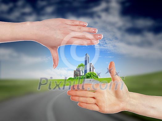 Collage with human hands and house against blue sky Collage with human hands and house against blue sky