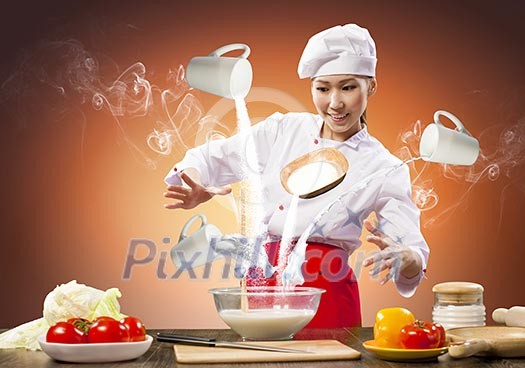 Asian female cooking with magic against color background