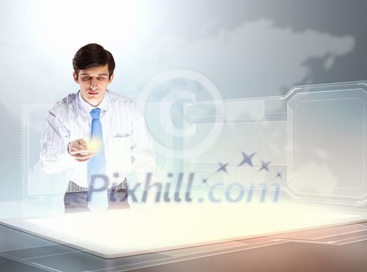 young businessman touching icon of high-tech image young businessman touching icon of high-tech image