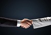 image of business handshake against black background