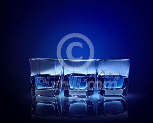 Image of three glasses of blue liquid Image of three glasses of blue liquid