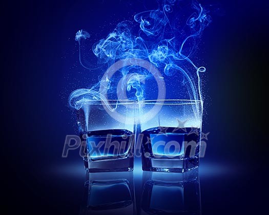 Two glasses oа blue cocktail with fume going out Two glasses oа blue cocktail with fume going out