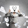 Image of businesswoman holding message board against face. Conceptual photo