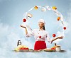 juggler female asian cook against color background