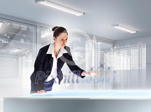 Image of young businesswoman clicking icon on high-tech picture