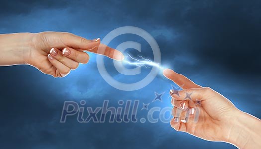 Two human hands in contact with bright flash Two human hands in contact with bright flash