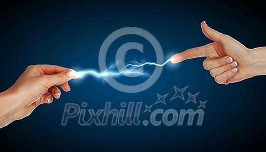 Two human hands in contact with bright flash Two human hands in contact with bright flash