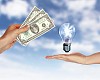 Human hands with money and electric bulb against blue sky