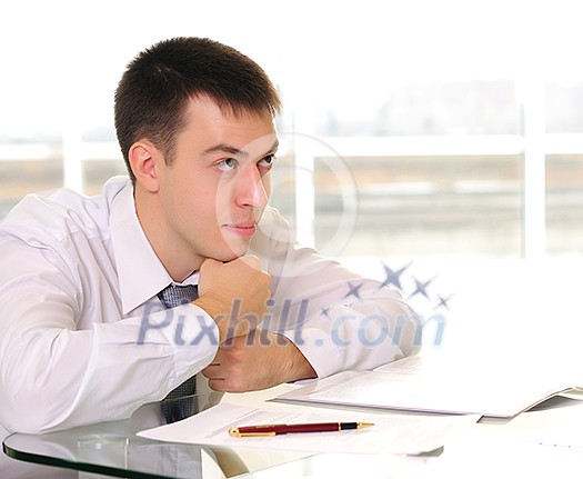 Young business man in the office workplace. Young business man in the office workplace.