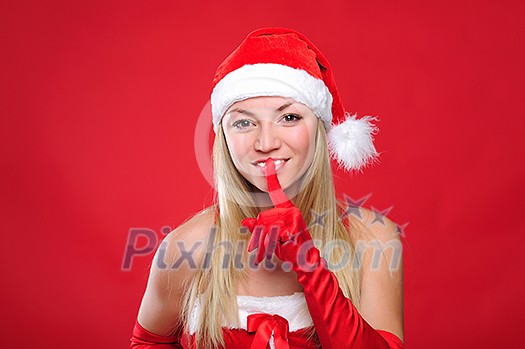 Portrait of a young charming girl dressed as Santa. Happy New Year!