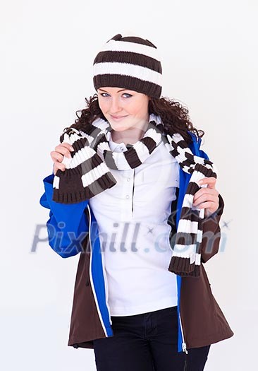 young pretty woman wearing winter hat and scarf