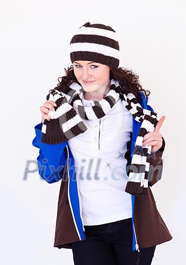 young pretty woman wearing winter hat and scarf