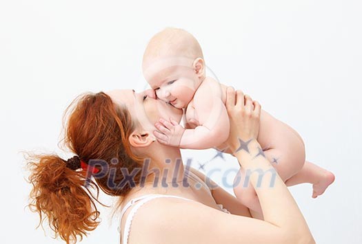 Portrait of a young child and his mother a white background. Baby. Portrait of a young child and his mother a white background. Baby.