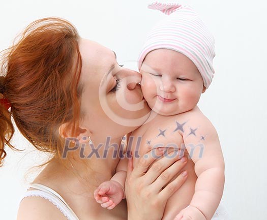 Portrait of a young child and his mother a white background. Baby. Portrait of a young child and his mother a white background. Baby.