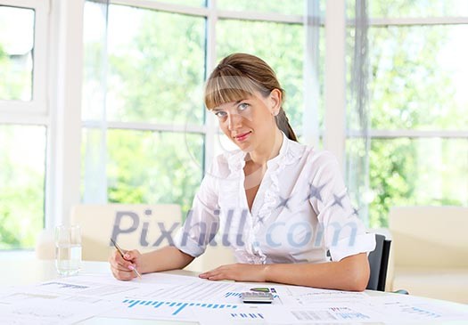 business woman in office working with papers business woman in office working with papers
