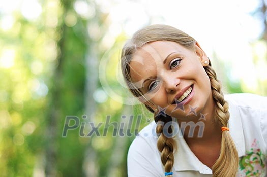 Young beautiful girl in a summer forest Young beautiful girl in a summer forest