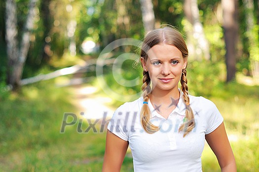Young beautiful girl in a summer forest Young beautiful girl in a summer forest